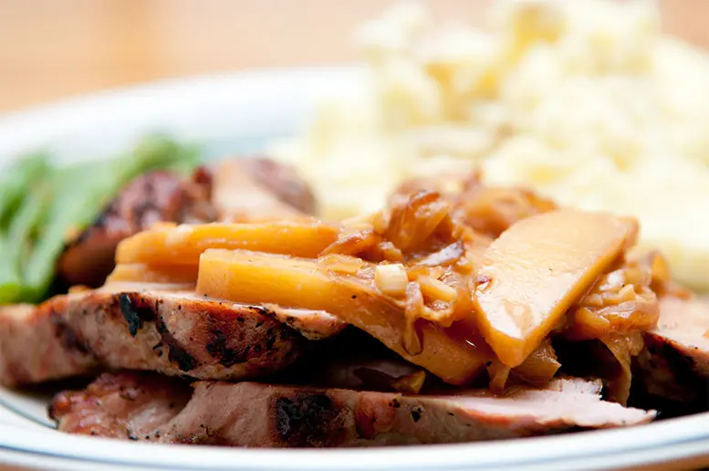 portion-mouthwatering-roasted-pork-covered-with-cider-chunky-applesauce