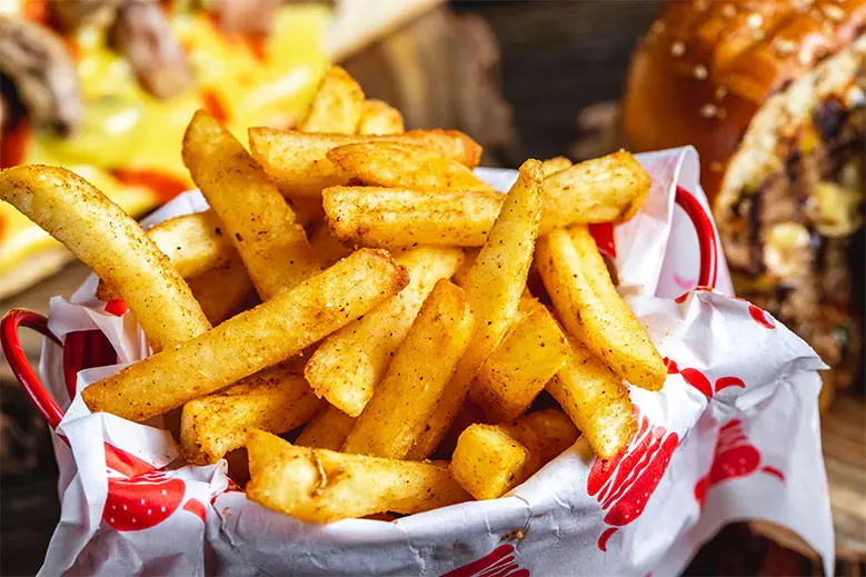 side-view-french-fries-with-seasoning